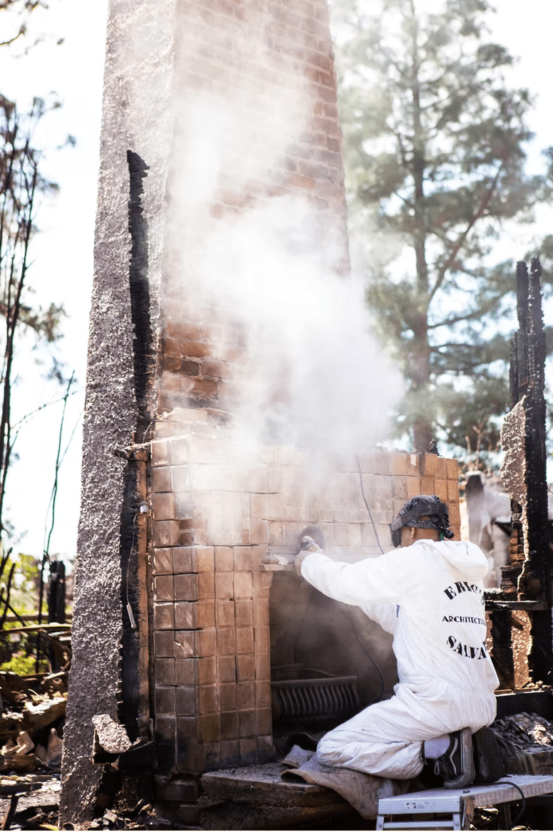 Tiles being removed from chimney