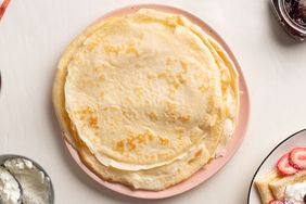 simple crepes stacked on a plate
