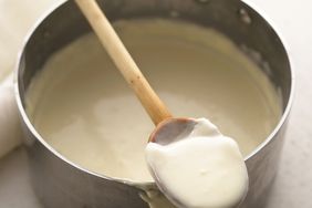 white sauce in metal pot