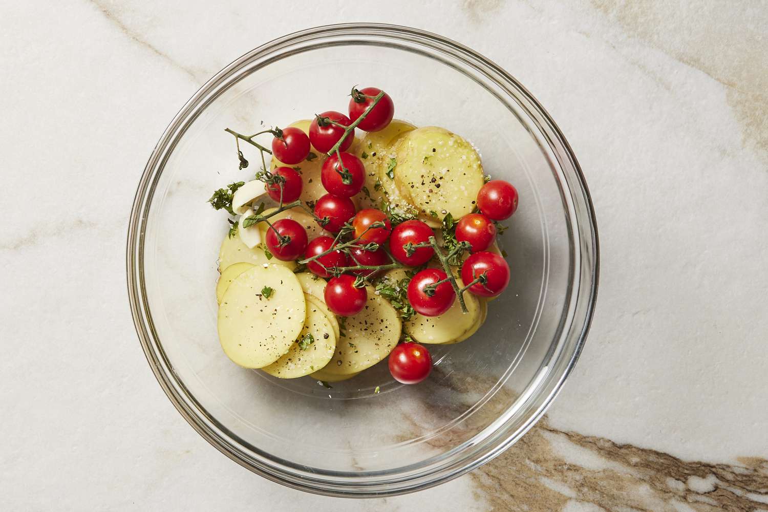 Tomatoes and potatoes in olive oil