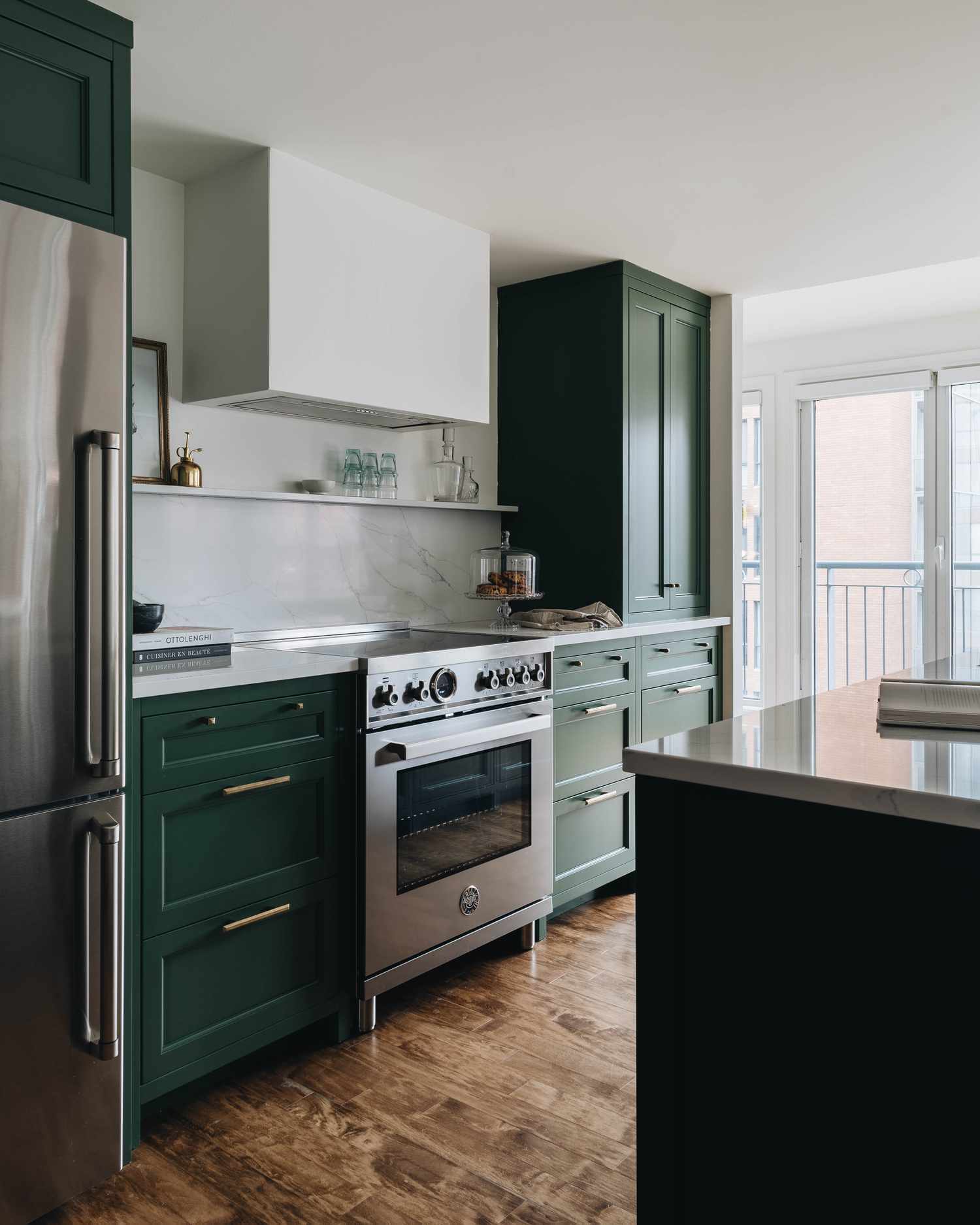 green kitchen cabinets with brass hardware