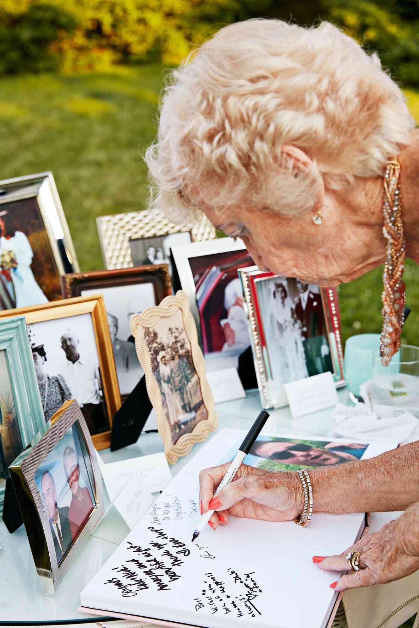 wedding grandmother signing guest book
