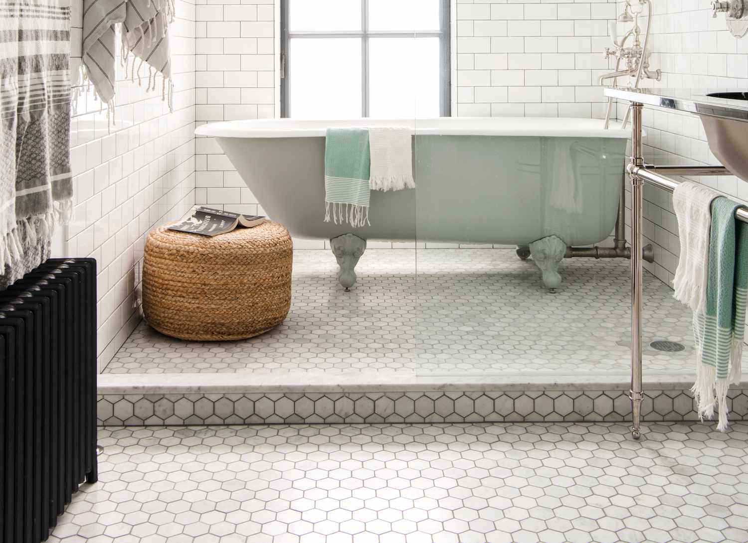 bathroom with small hexogon tile and bathtub