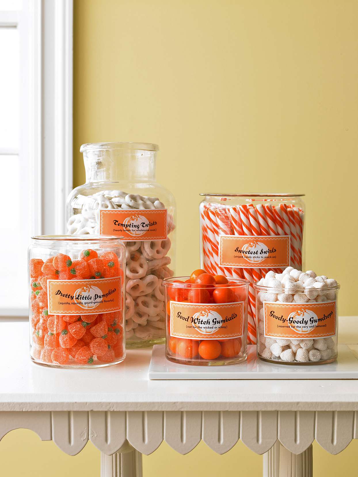 halloween candy jars on white table