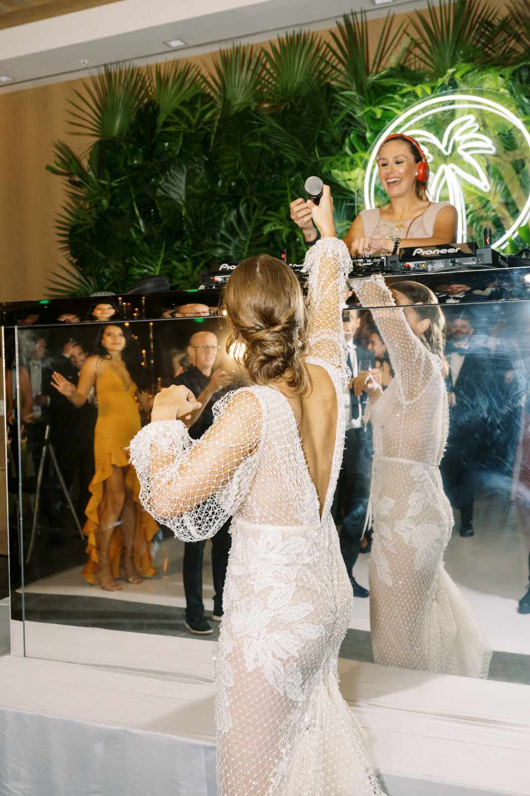 bride grabbing mic from reception dj