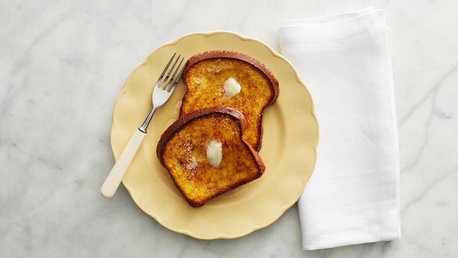 two slices of baked french toast on a plate