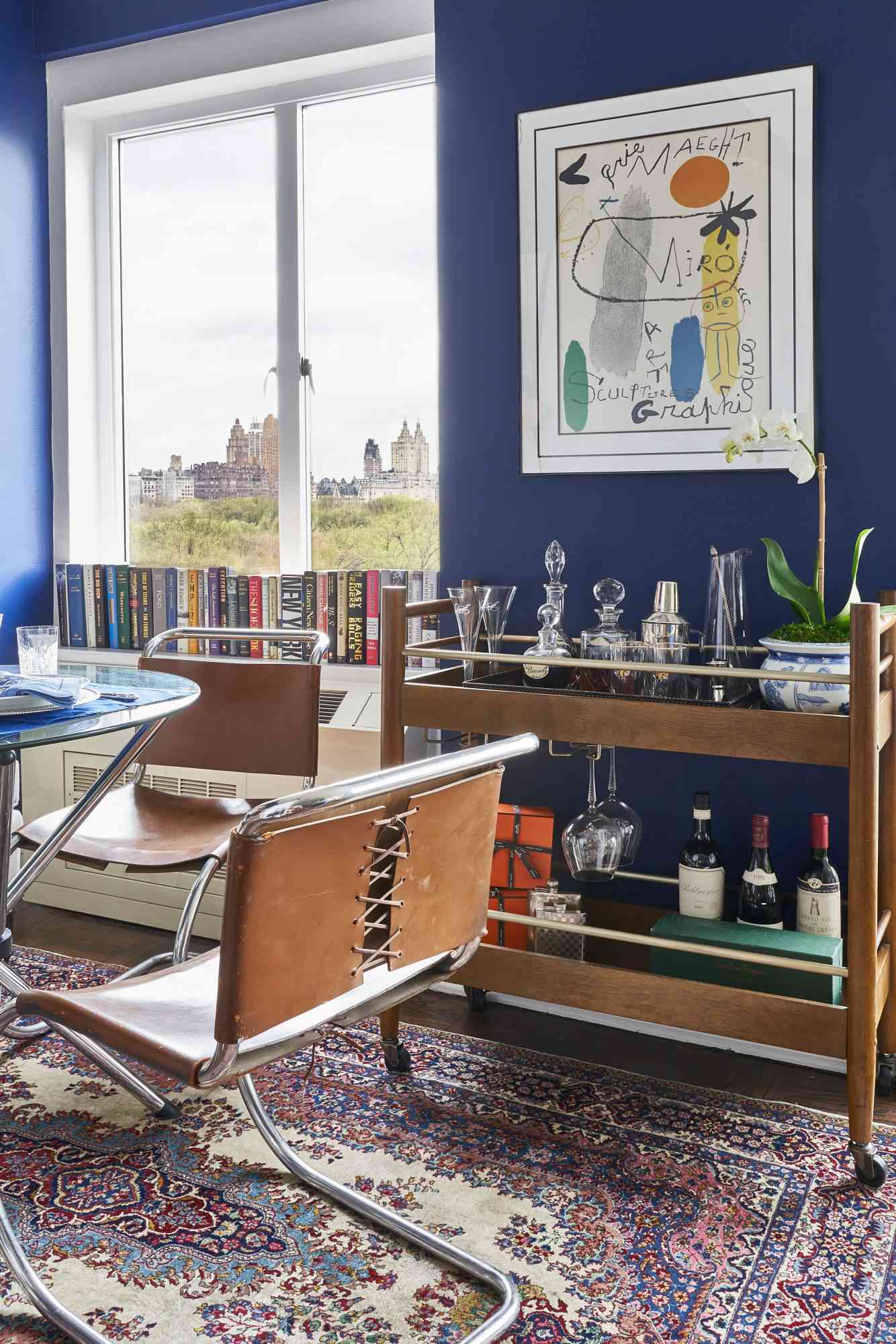 blue dining room with bar cart