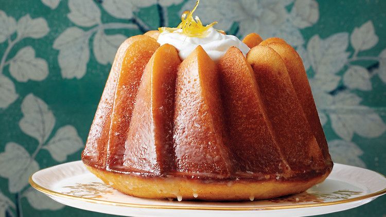 citrus bundt cake on cake stand