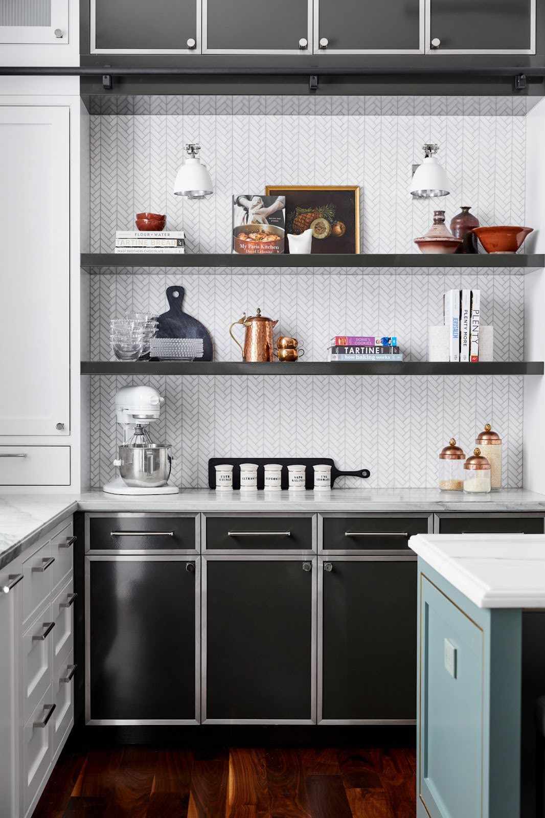 A white kitchen with black cabinets