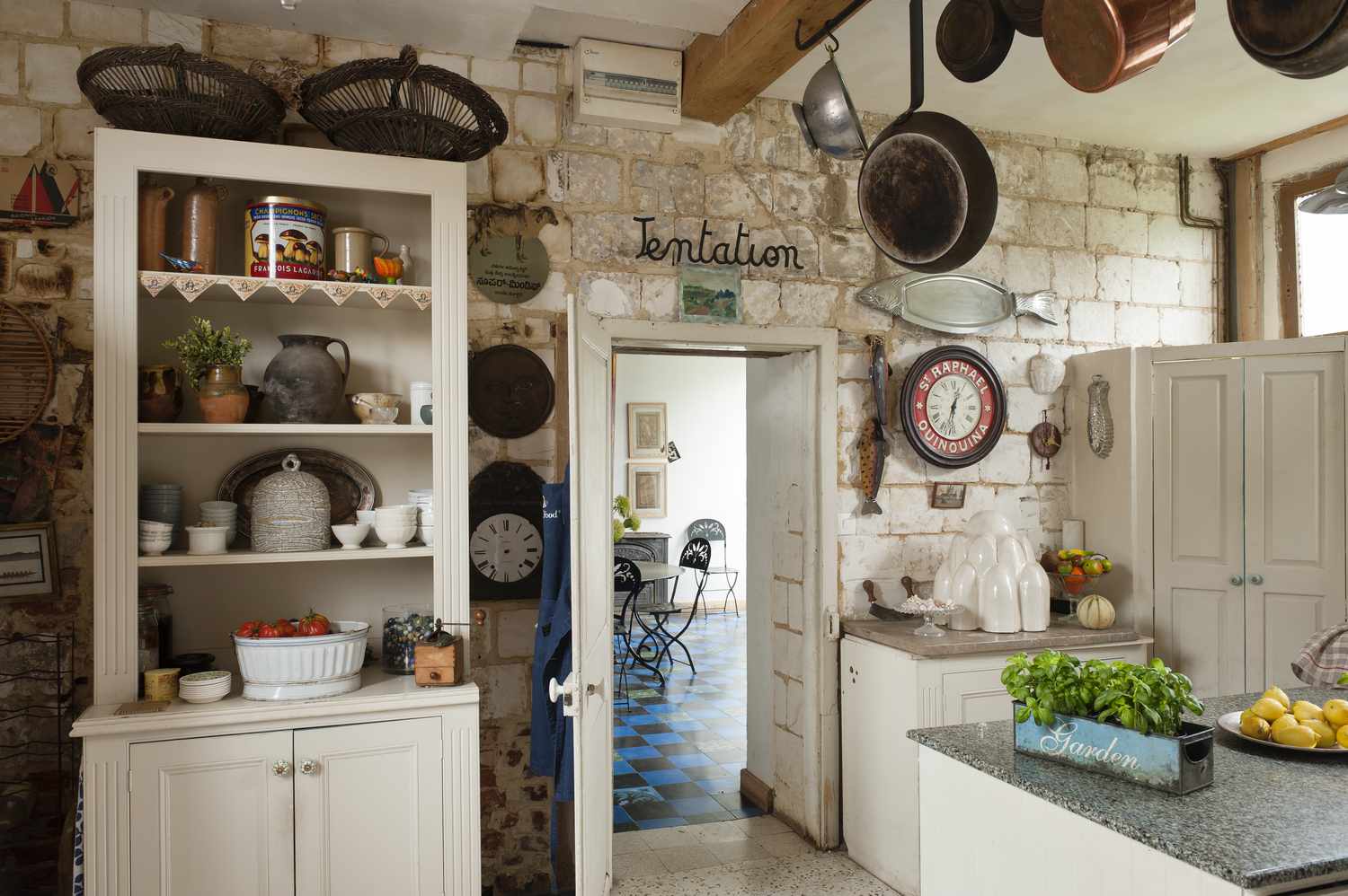 kitchen with pots and pans and signs