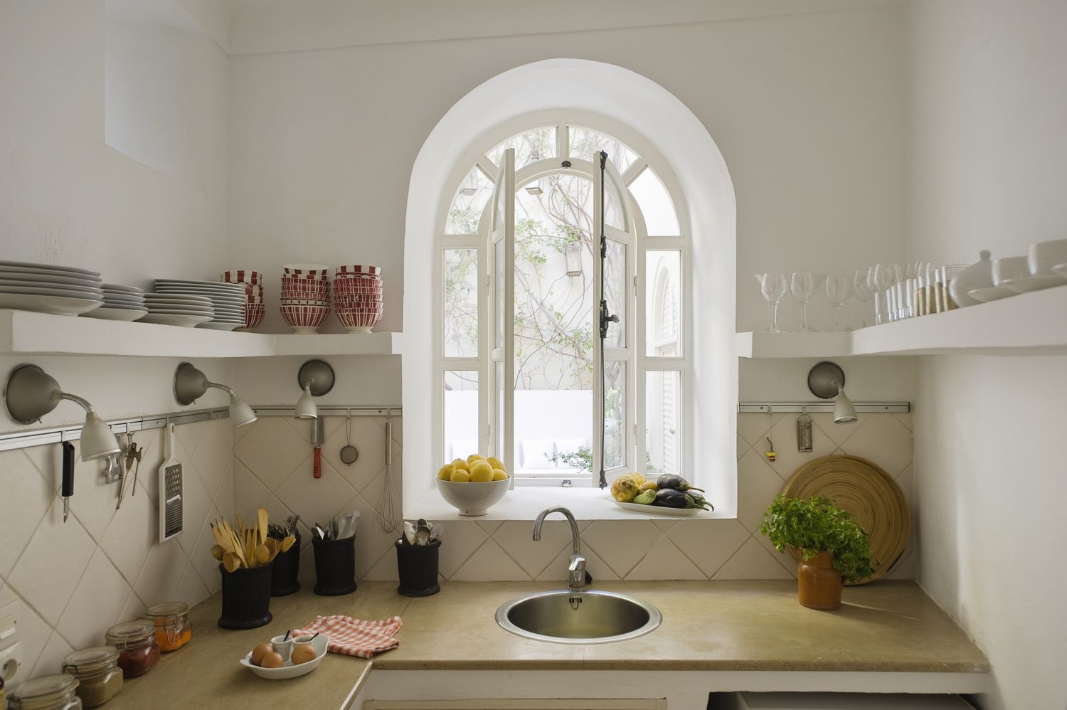 Arched window over kitchen sink