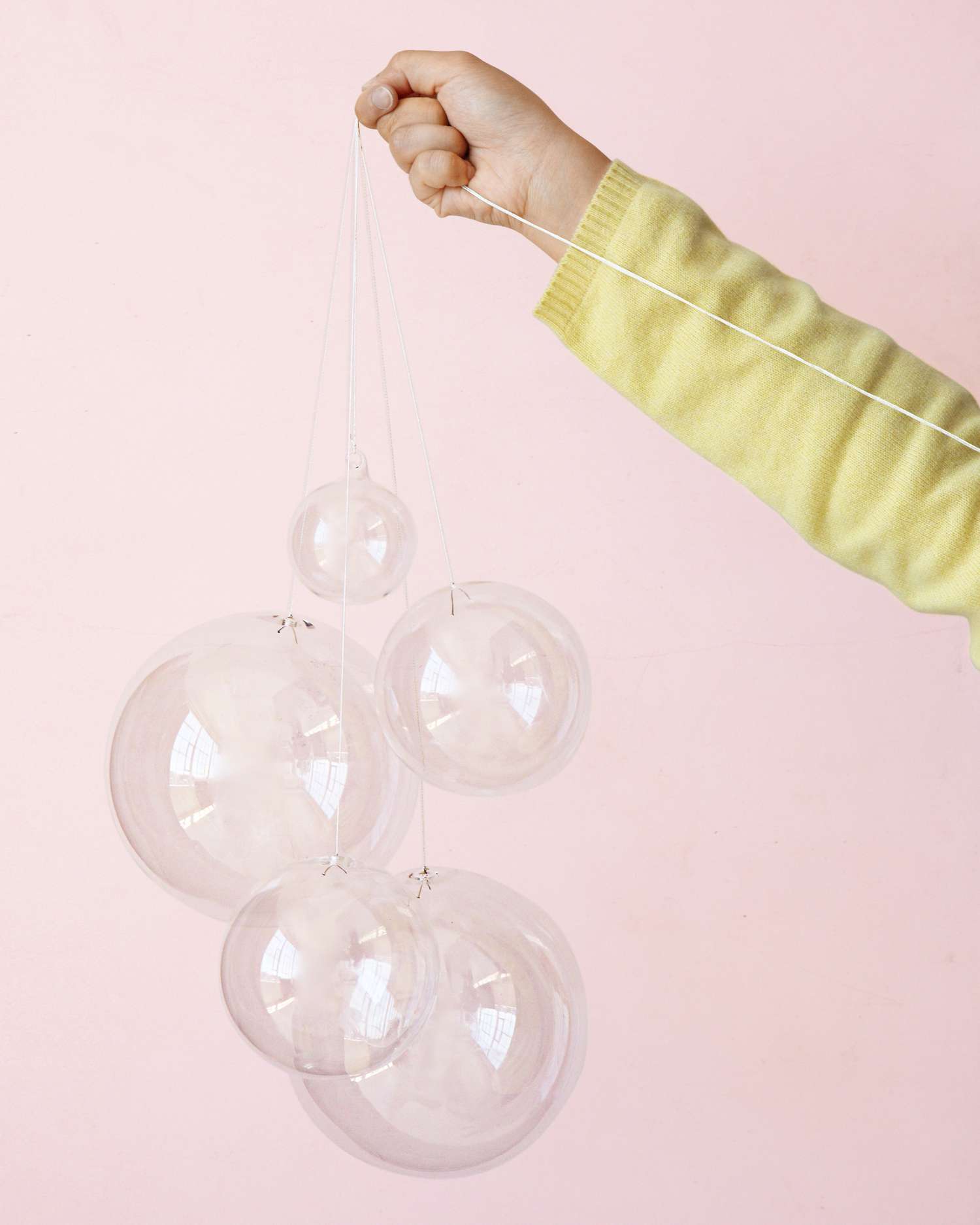 Hand holding decorative bubble chandelier