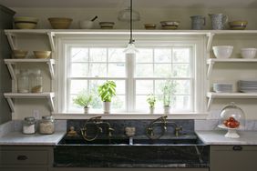 A clean, organized kitchen with open shelves