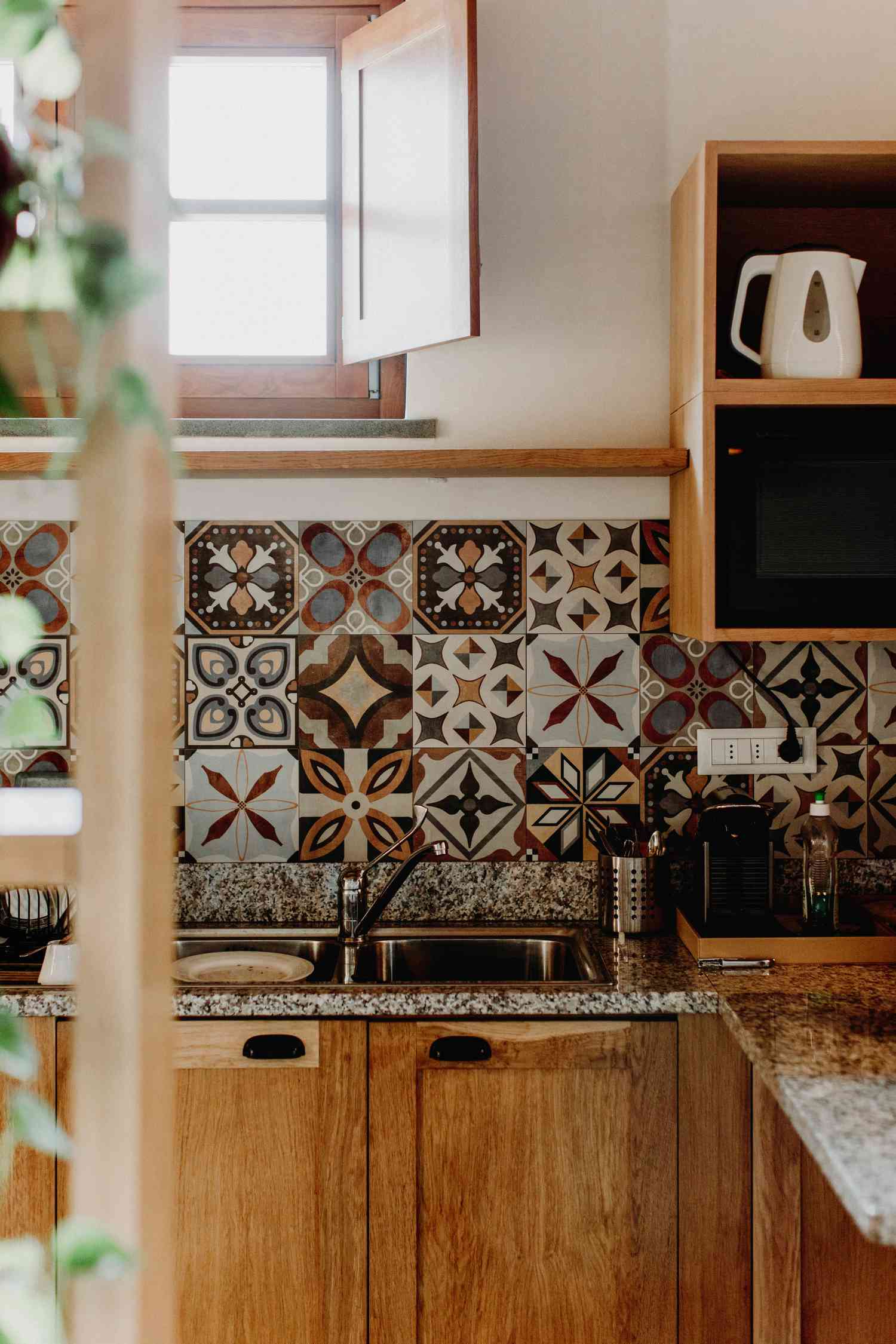 Kitchen with patterned wall tiles