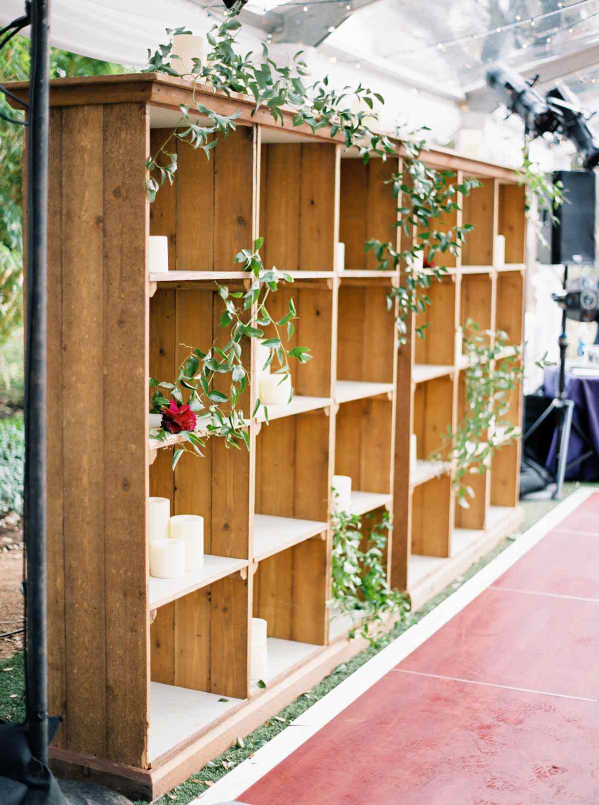 greenery garland and single rose adhered to shelves