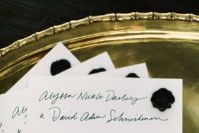 wedding programs on gold tray