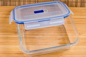 A glass food storage container with a plastic lid