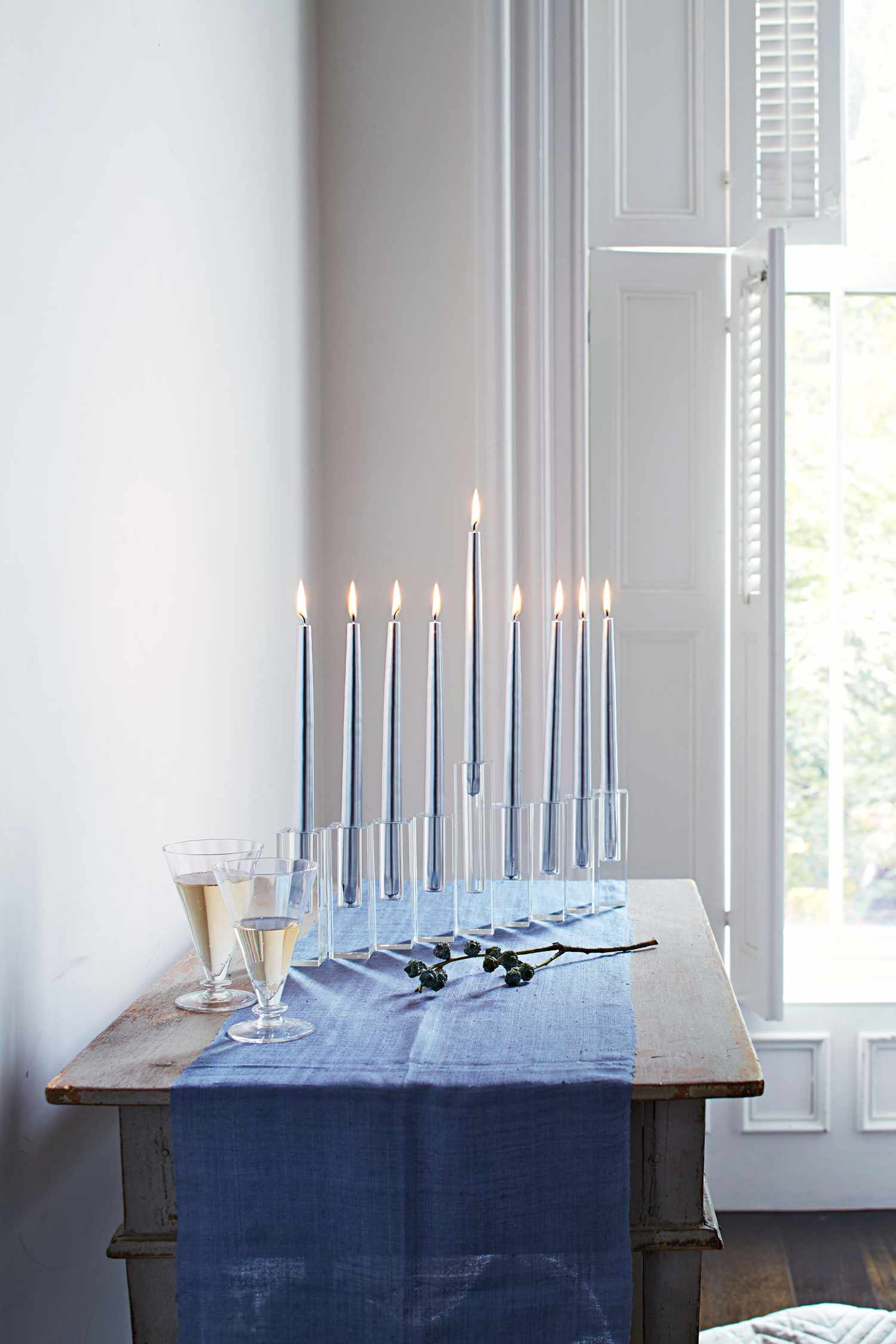 menorah of glass bud vases