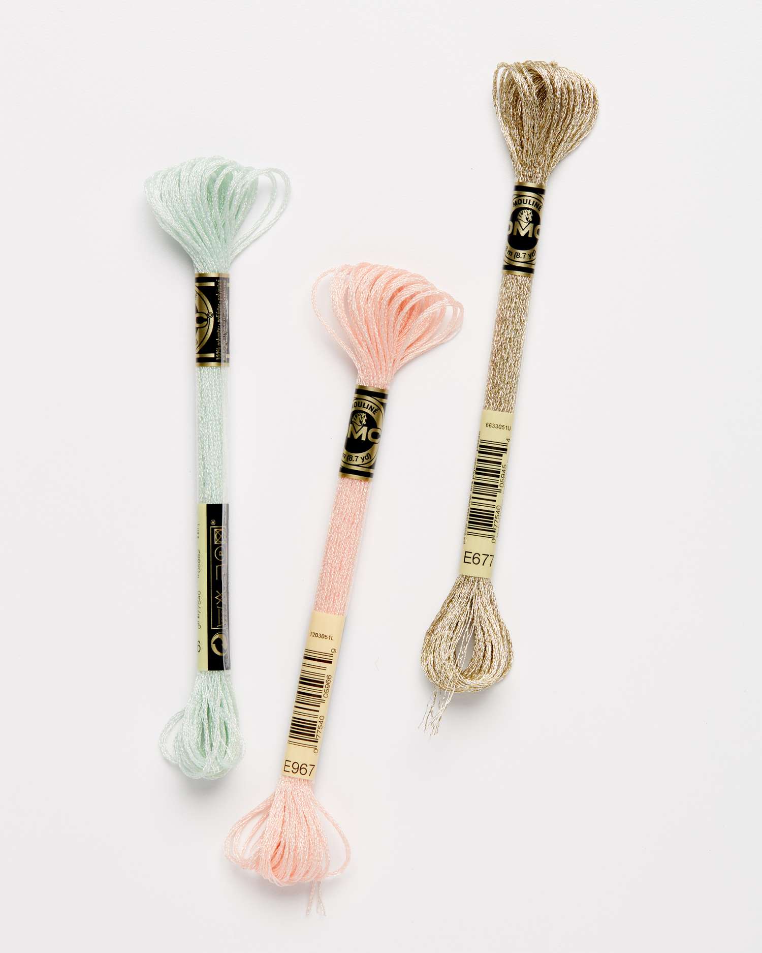 three types of light effects embroidery floss against a white background