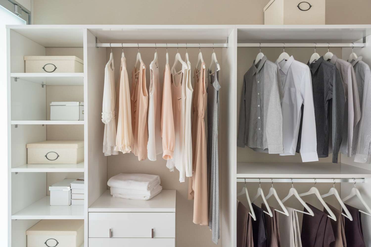 Organized clothing and storage boxes in a closet