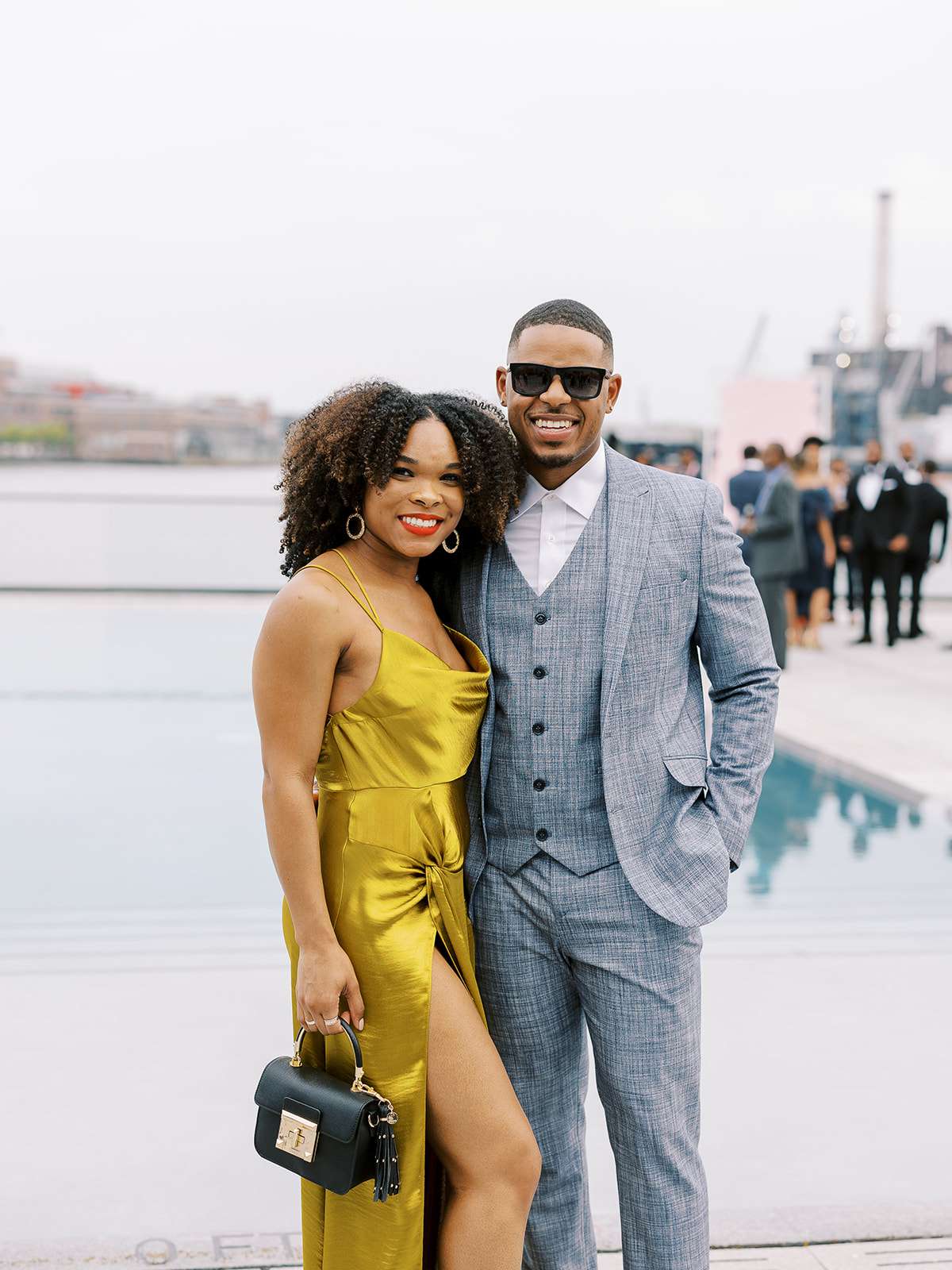 wedding guests near water