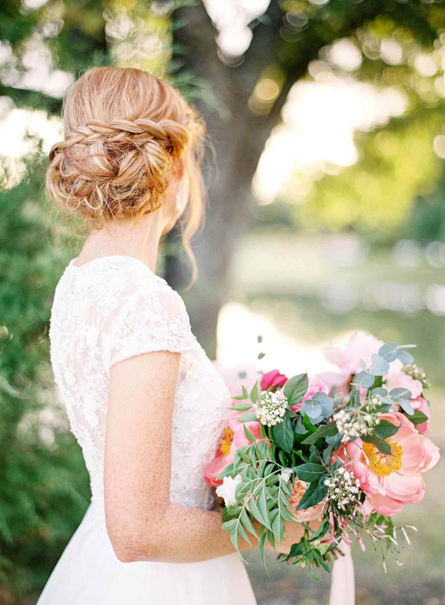 bride with braid-wrapped updo