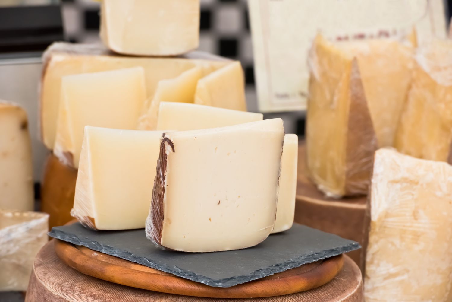 Slices of cheese arranged on a slate board