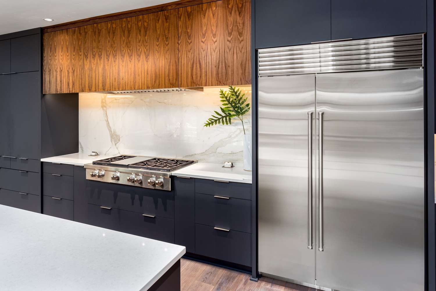 Modern kitchen with large stainless steel freezer refrigerator