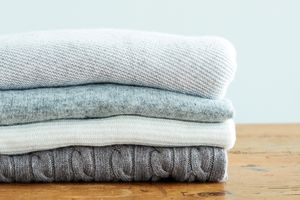 cashmere sweaters on wood table