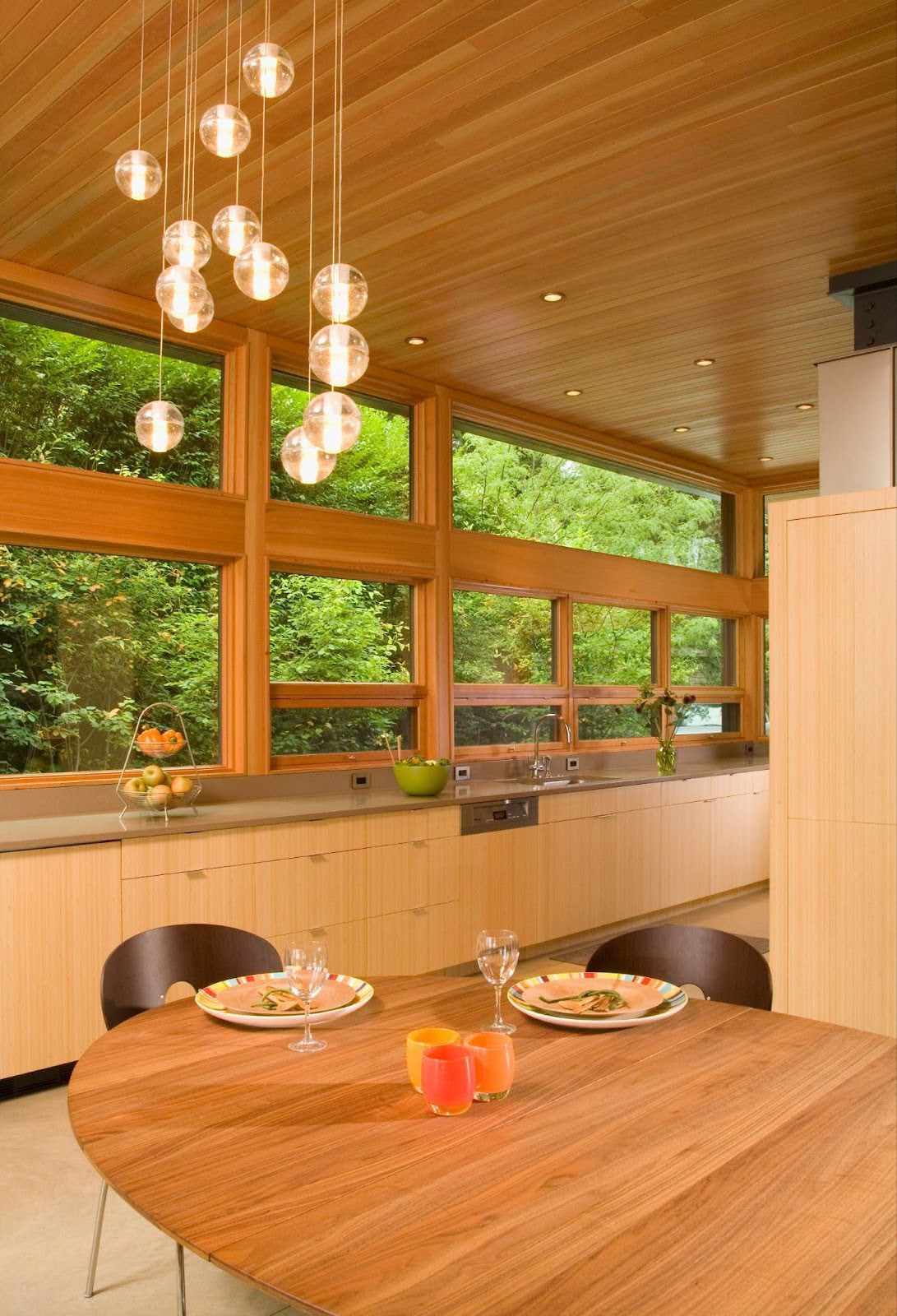 a kitchen with warm lighting and wood panels