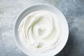 blue and gray background with a bowl of sour cream