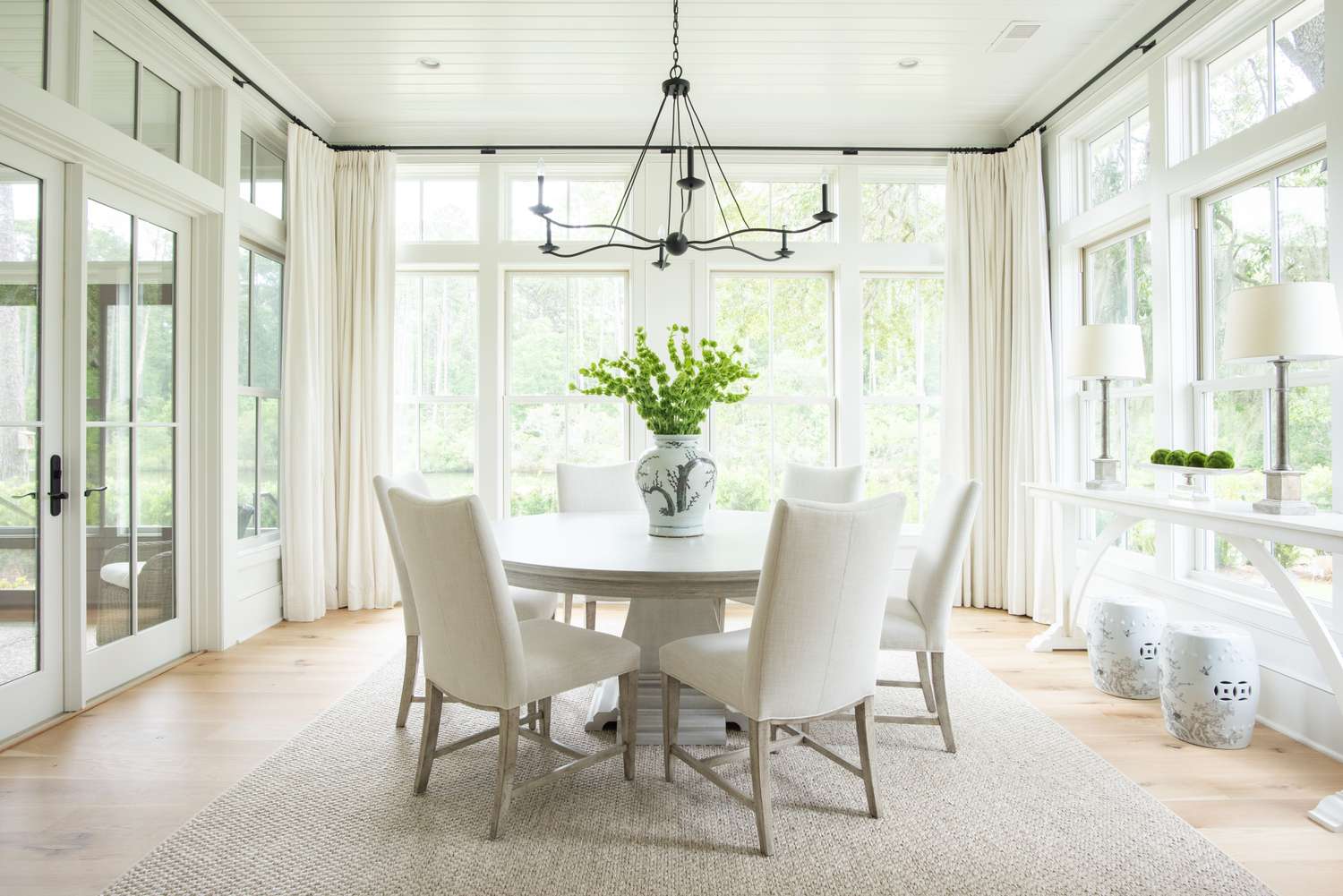 a white dining room with natural light 