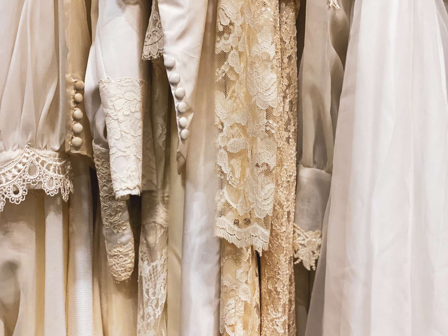 rack of vintage wedding dresses