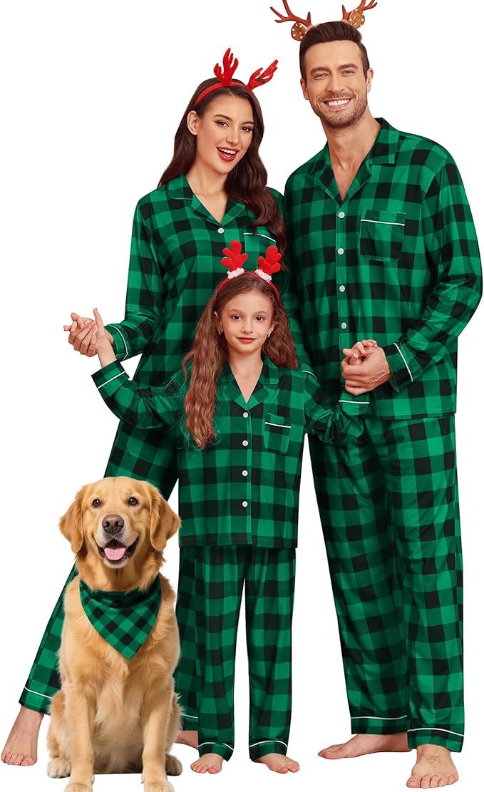 A family wearing matching green pajamas with a dog in a matching bandana posing festively with reindeer headbands