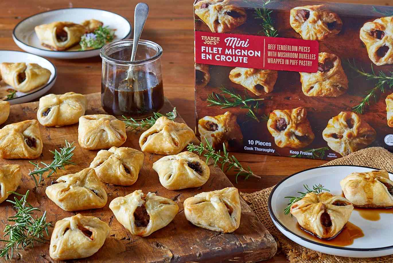 Mini beef wellington bites displayed with packaging on a table