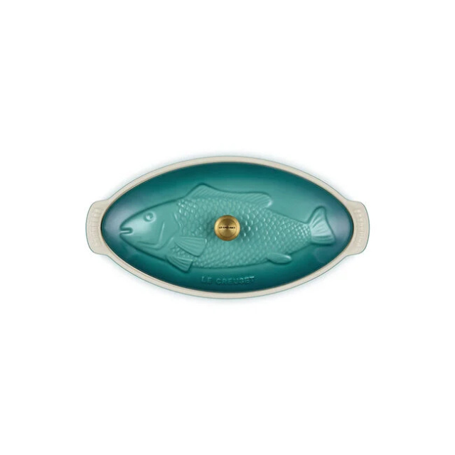 Cooking pot lid shaped like a fish oval design with a central knob