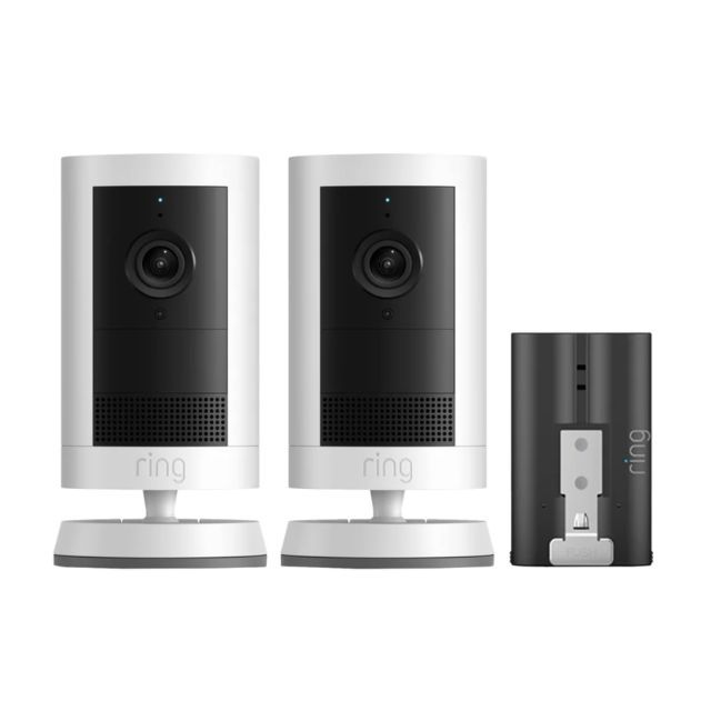 Two Ring security cameras and a black standalone accessory