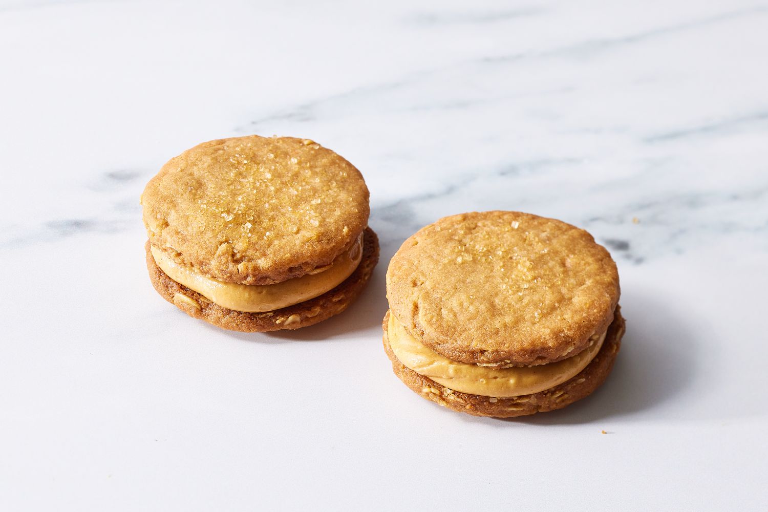 Two finished peanut butter sandwich cookies