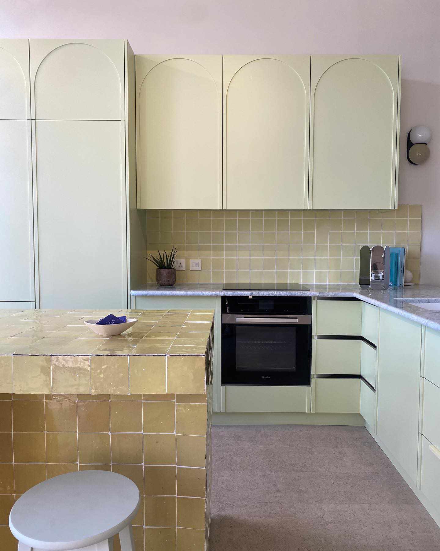 Modern kitchen with tiled island and cork flooring