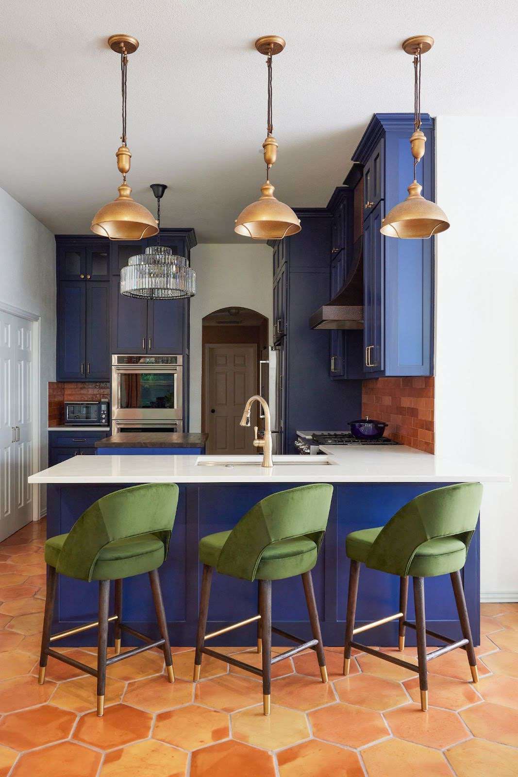 a kitchen with blue cabinets