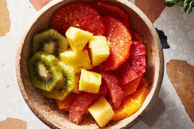 tropical fruit juice salad with pineapple and kiwi