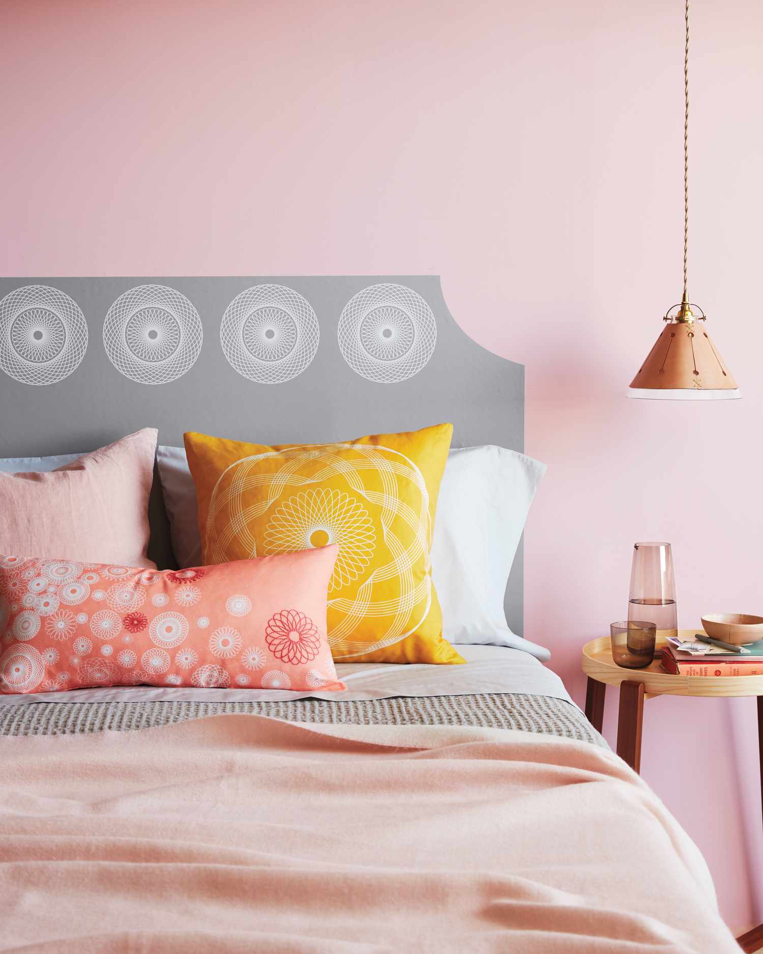 spirograph-decorated headboard and pillows