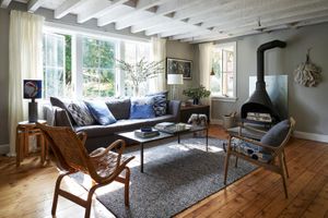 Natural living room with furniture and wood burning stove