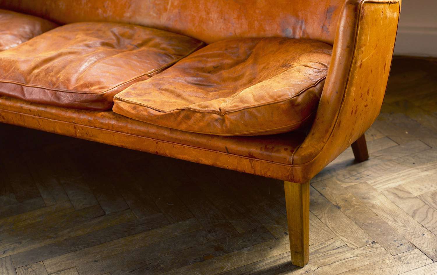 Worn in leather sofa