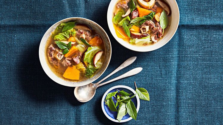 beef pumpkin and shiitake soup served with fresh basil