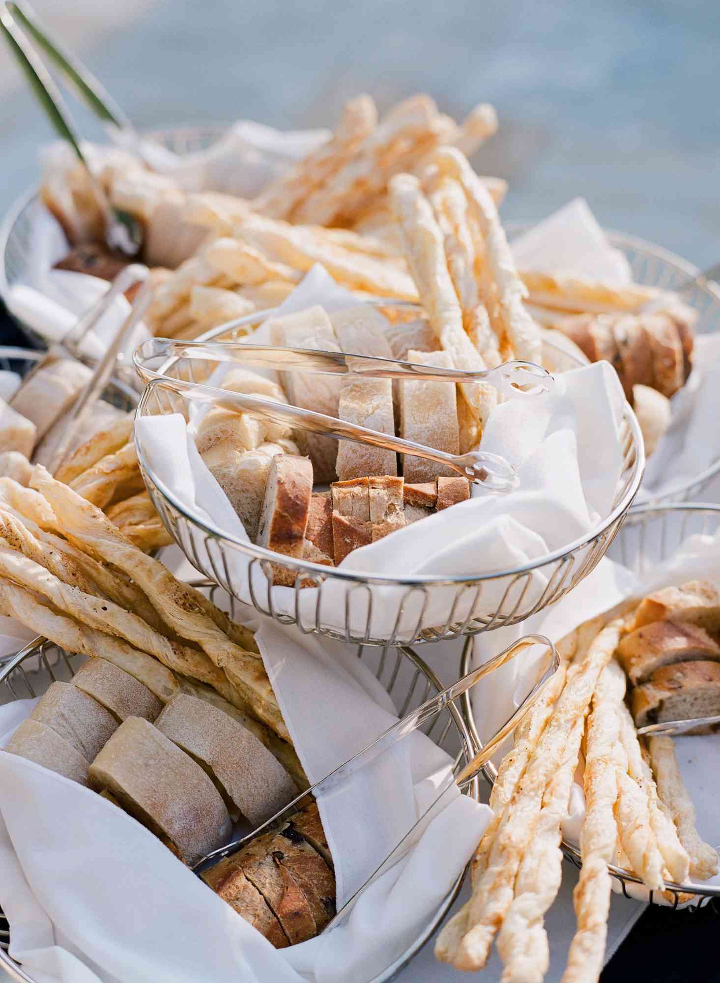 assortment of bread in wire baskets