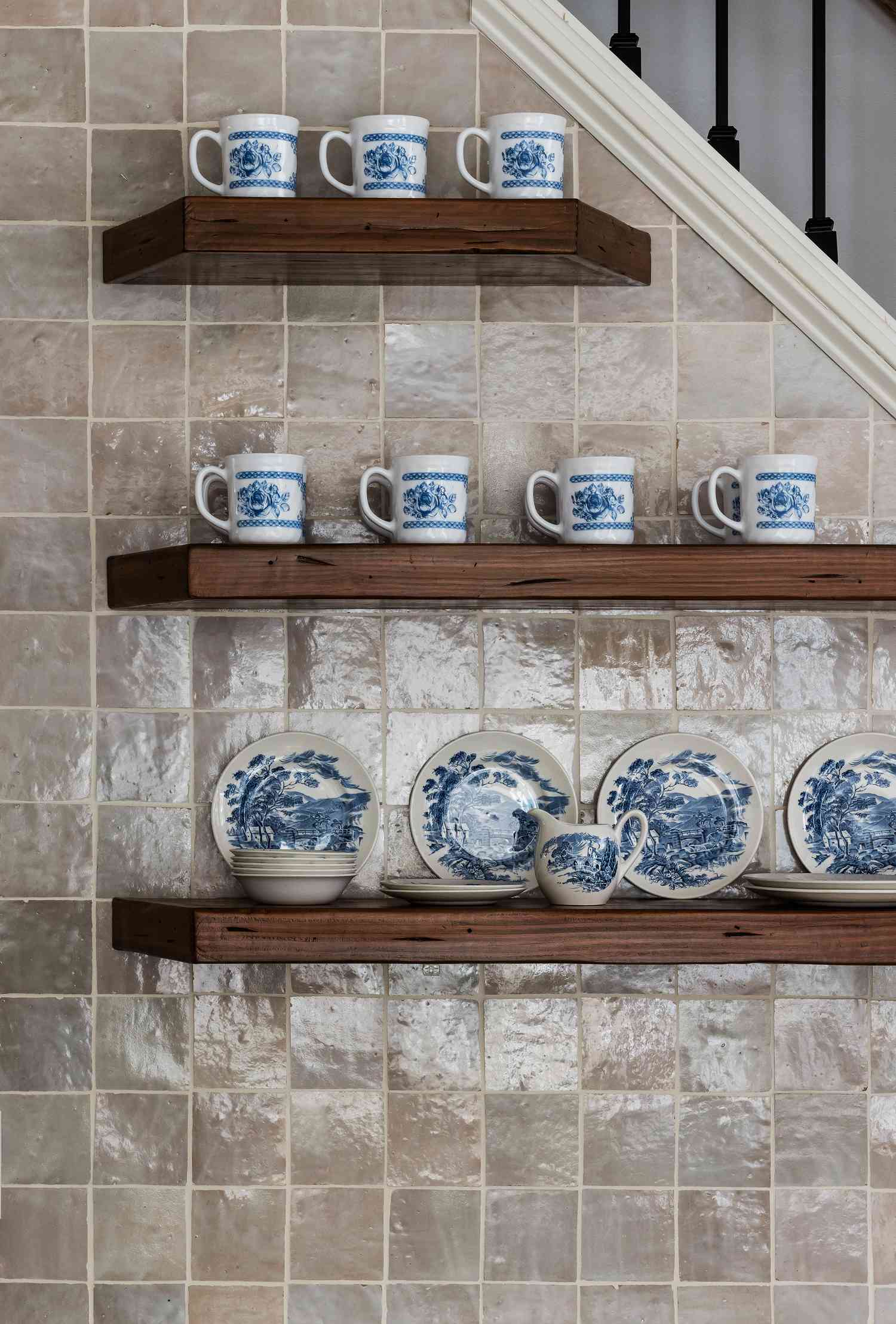 floating shelves with blue and white dinnerware