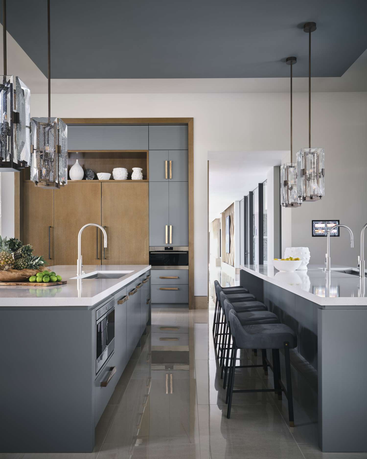 blue kitchen with brass hardware
