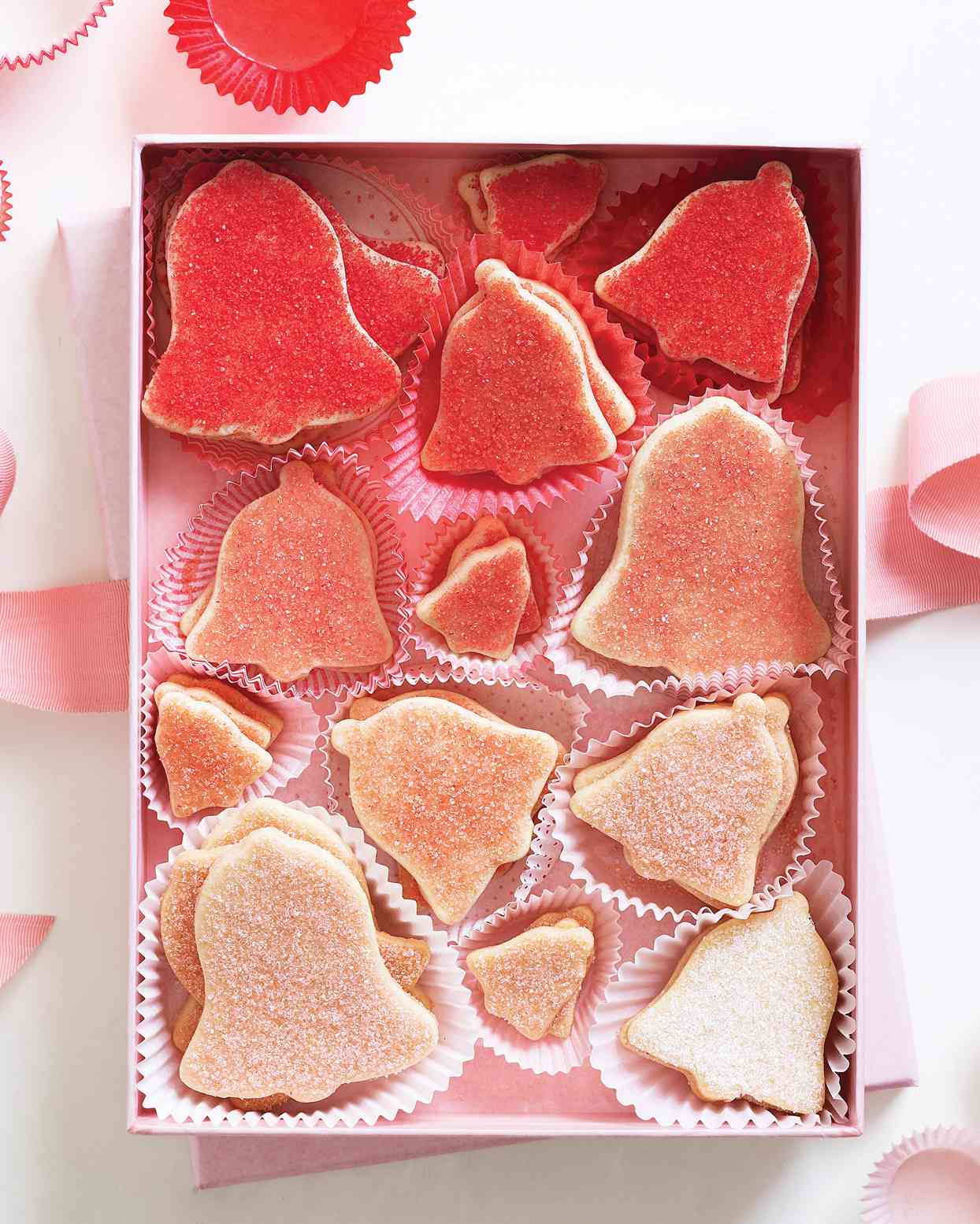 bell shaped red pink and white glitter coated cookies