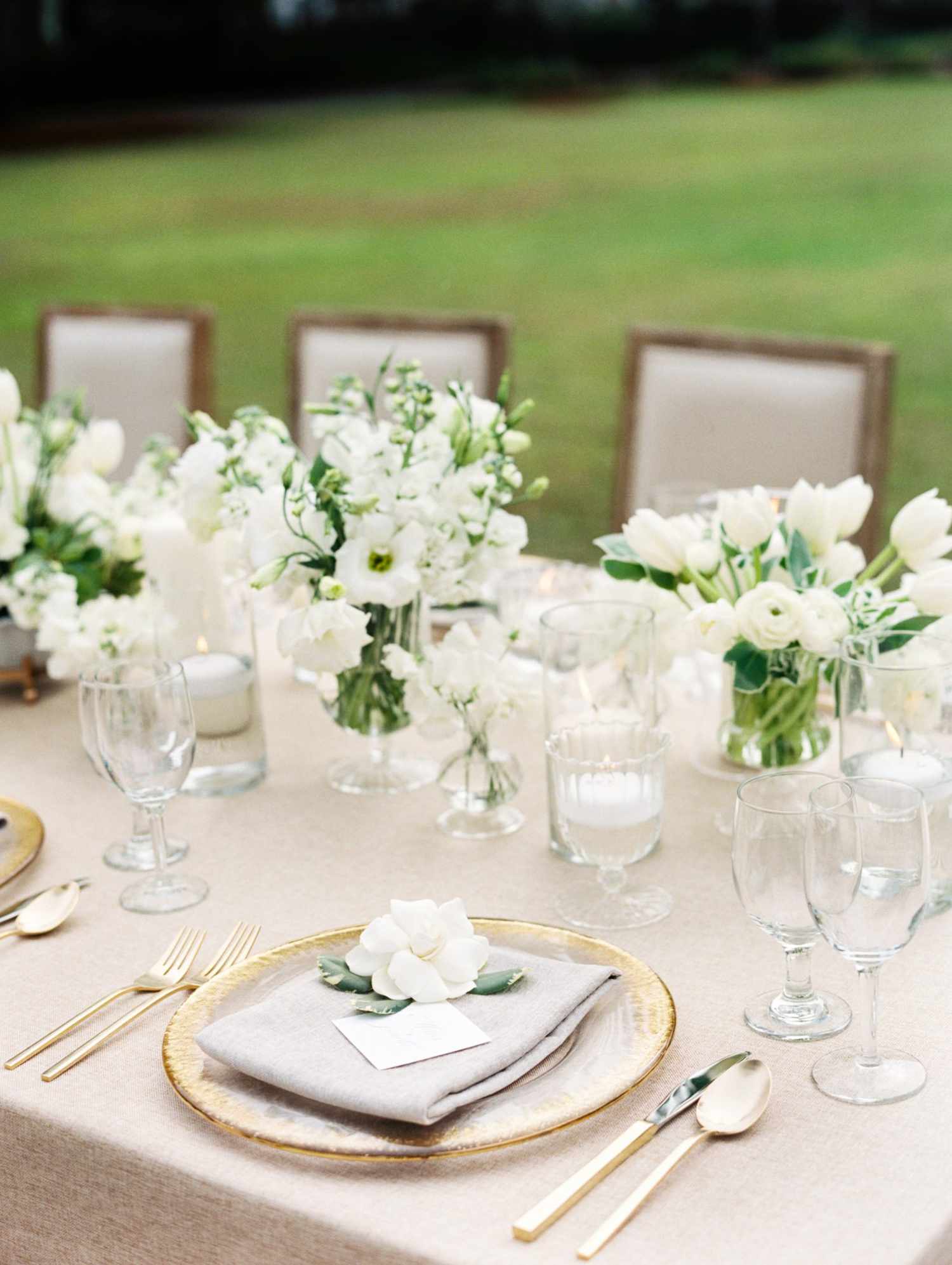 All-White Cluster centerpieces with Ranunculus